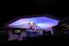 Светещ опънат таван над бар с RGB LED осветление включено на лилаво.